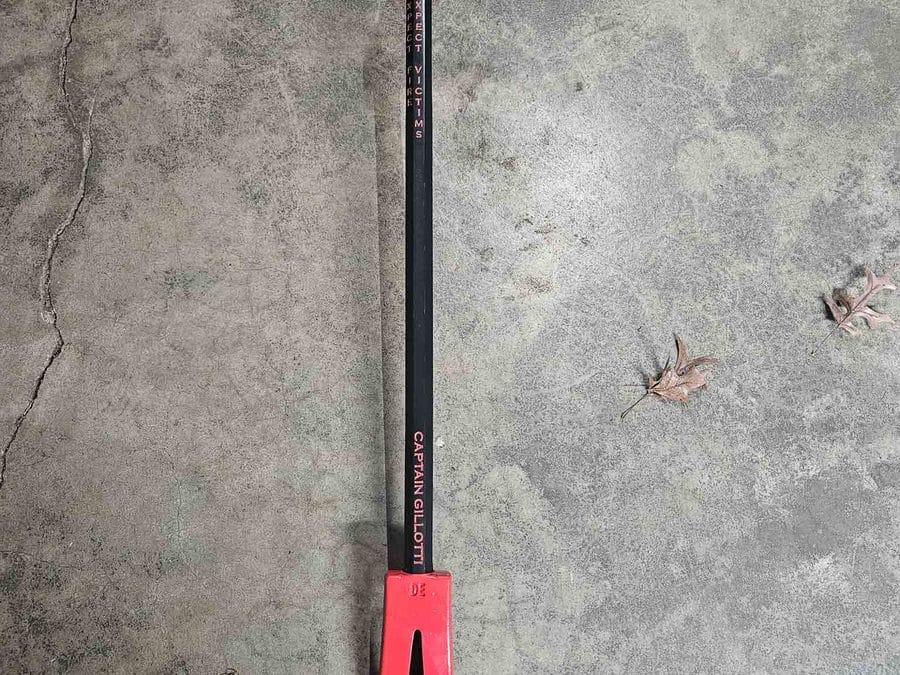 Orange Cerakoted Halligan bar with laser-engraved text