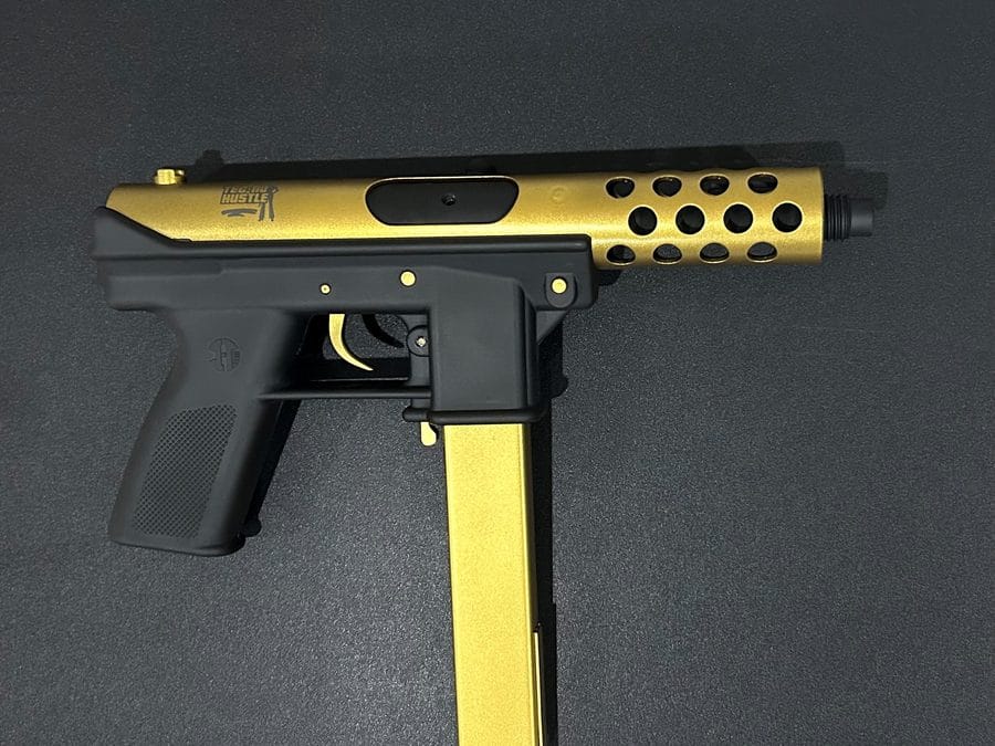 Gold and black two-tone Cerakote pistol
