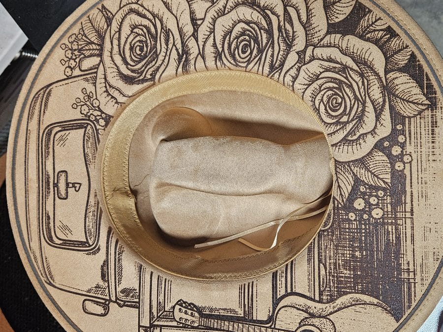 Engraved wide-brim hat with rose and truck design