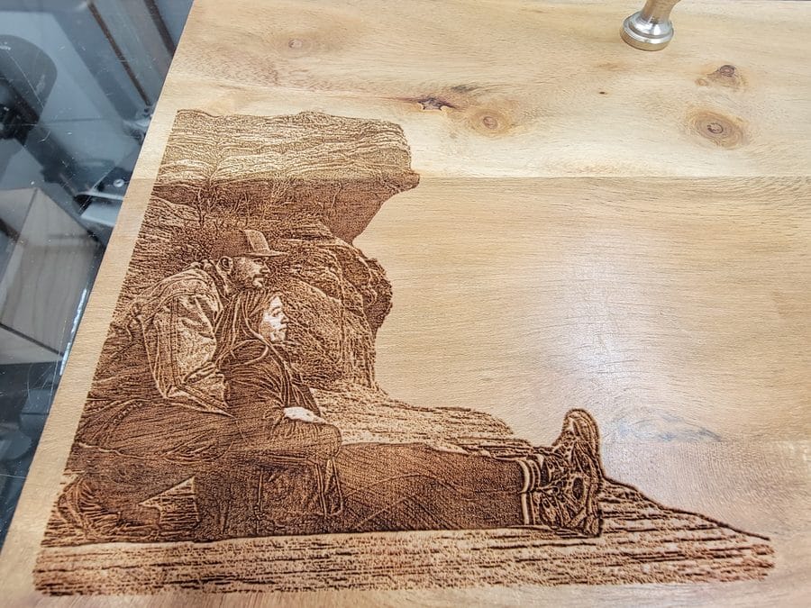 Photo-realistic engraved portrait on a wood cutting board